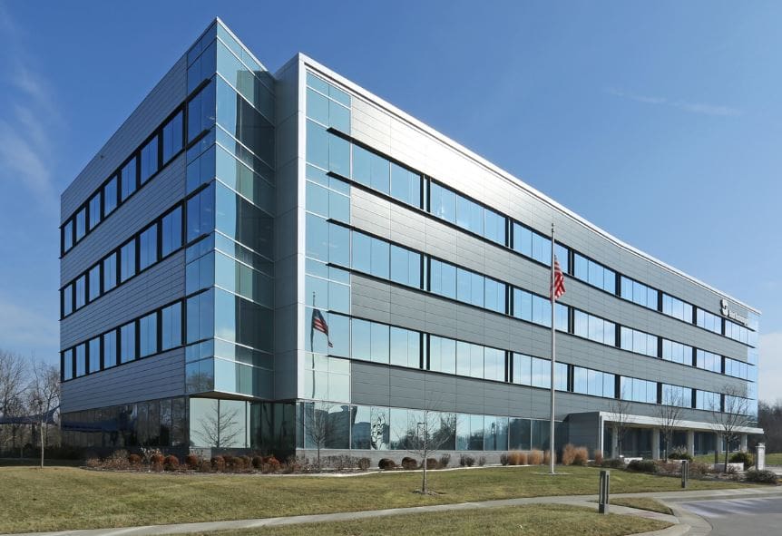 A gold letter w with the letters in the shape of a w.